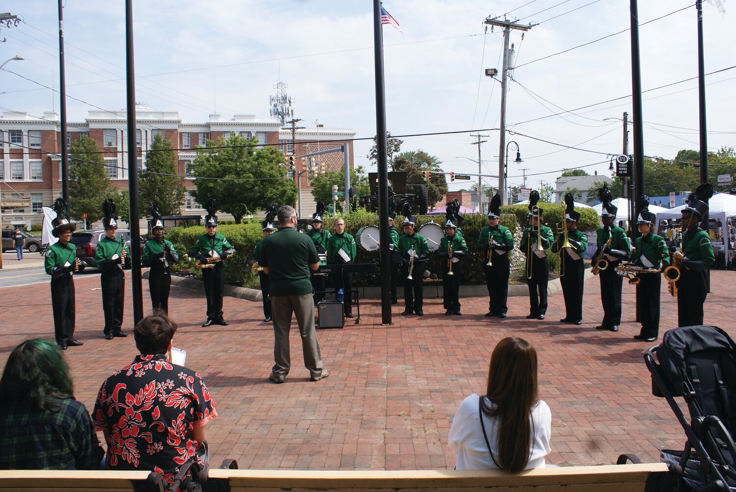 MUSICAL GUESTS: The Cranston High School East band entertained attendees to the Spring Festival by setting up on Rolfe Square in full school band regalia.